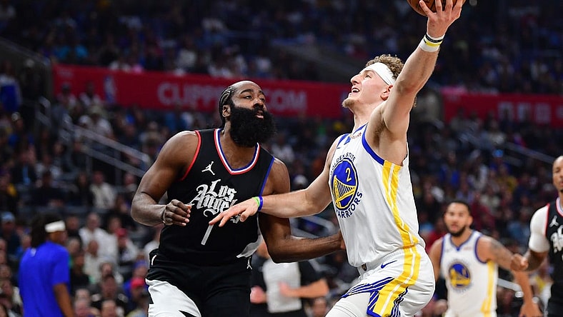 Dec 2, 2023; Los Angeles, California, USA; Golden State Warriors guard Brandin Podziemski (2) moves to the basket against Los Angeles Clippers guard James Harden (1) during the first half at Crypto.com Arena. Mandatory Credit: Gary A. Vasquez-USA TODAY Sports