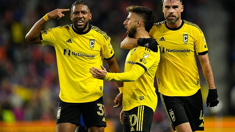 Dec 2, 2023; Cincinnati, Ohio, USA; Columbus Crew defender Steven Moreira (31) and defender Rudy Camacho (4) celebrate a goal by forward Diego Rossi (10) during the second half of the MLS Cup Eastern Conference Finals against the FC Cincinnati against the Columbus Crew at TQL Stadium.
