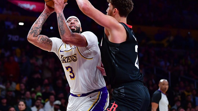 Dec 2, 2023; Los Angeles, California, USA; Los Angeles Lakers forward Anthony Davis (3) moves to the basket against Houston Rockets center Alperen Sengun (28) during the first half at Crypto.com Arena. Mandatory Credit: Gary A. Vasquez-USA TODAY Sports