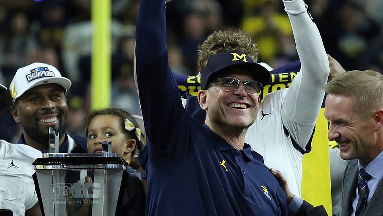 Michigan coach Jim Harbaugh celebrates after U-M's 26-0 win over Iowa in the Big Ten championship game on Saturday, Dec. 2, 2023, in Indianapolis.