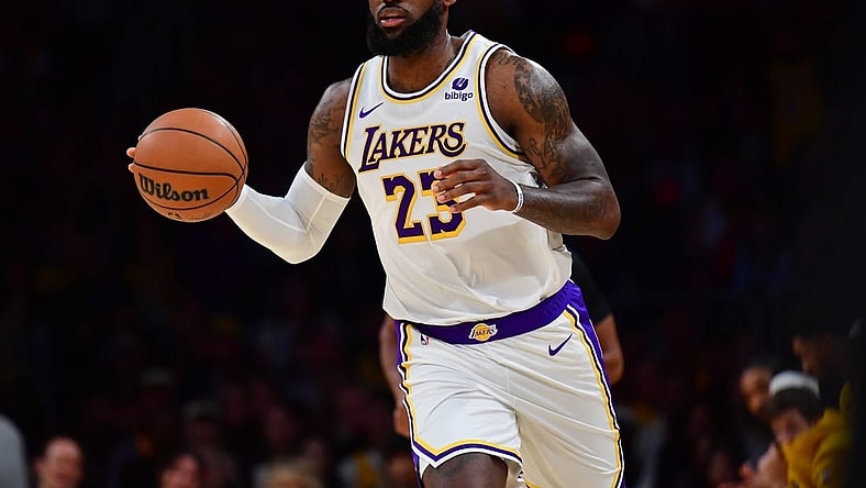 Dec 2, 2023; Los Angeles, California, USA; Los Angeles Lakers forward LeBron James (23) controls the ball against the Houston Rockets during the first half at Crypto.com Arena. Mandatory Credit: Gary A. Vasquez-USA TODAY Sports