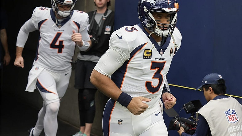 Dec 3, 2023; Houston, Texas, USA; Denver Broncos quarterback Russell Wilson (3) and quarterback Jarrett Stidham (4) run out on the field before playing against the Houston Texans at NRG Stadium. Mandatory Credit: Thomas Shea-USA TODAY Sports