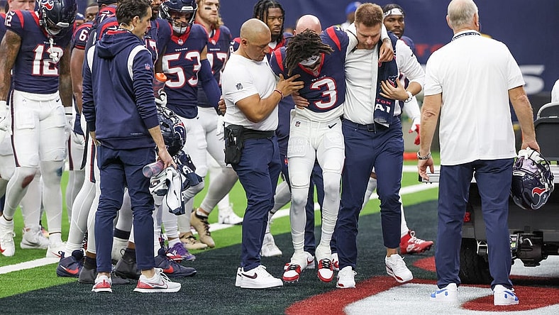 Dec 3, 2023; Houston, Texas, USA;  Trainers move an injured Houston Texans wide receiver Tank Dell (3) two the cart as he injured himself on a touchdown play against the Denver Broncos at NRG Stadium. Mandatory Credit: Thomas Shea-USA TODAY Sports