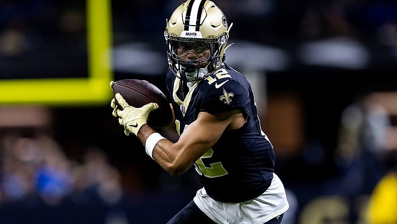 Dec 3, 2023; New Orleans, Louisiana, USA; New Orleans Saints wide receiver Chris Olave (12) catches a pass against the Detroit Lions during the first half at the Caesars Superdome. Mandatory Credit: Stephen Lew-USA TODAY Sports