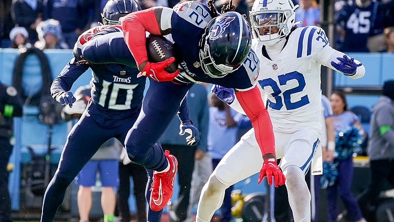 Tennessee Titans running back Derrick Henry (22) leaps for a touchdown against the Indianapolis Colts during the second quarter at Nissan Stadium in Nashville, Tenn., Sunday, Dec. 3, 2023.