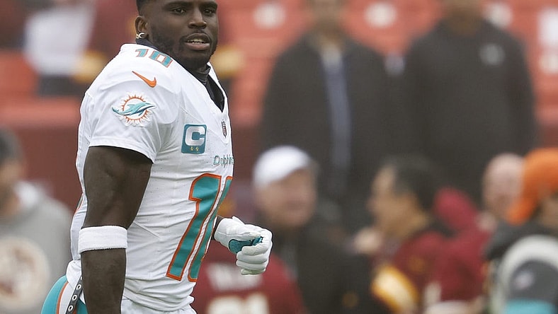 Dec 3, 2023; Landover, Maryland, USA; Miami Dolphins wide receiver Tyreek Hill (10) stands on the field during warm up prior to the game against the Washington Commanders at FedExField. Mandatory Credit: Geoff Burke-USA TODAY Sports