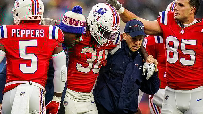 Dec 3, 2023; Foxborough, Massachusetts, USA; New England Patriots running back Rhamondre Stevenson (38) is helped off the field as they take on the Los Angeles Chargers in the second quarter at Gillette Stadium. Mandatory Credit: David Butler II-USA TODAY Sports