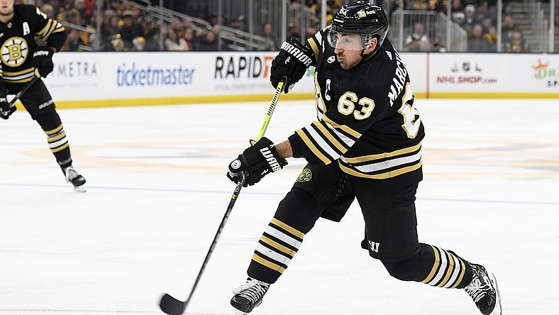 Dec 3, 2023; Boston, Massachusetts, USA; Boston Bruins left wing Brad Marchand (63) shoots the puck during the third period against the Columbus Blue Jackets at TD Garden. Mandatory Credit: Bob DeChiara-USA TODAY Sports