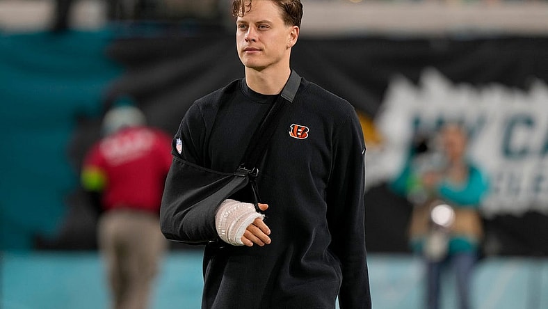 Cincinnati Bengals quarterback Joe Burrow takes the field to watch his team practice before facing the Jacksonville Jaguars at Everbank Stadium in Jacksonville, Florida Monday, December 4, 2023.