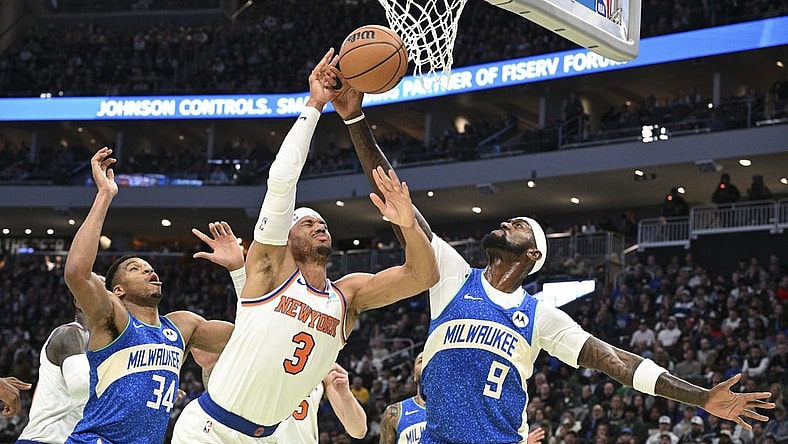 Dec 5, 2023; Milwaukee, Wisconsin, USA; New York Knicks guard Josh Hart (3) and Milwaukee Bucks forward Bobby Portis (9) battle for a rebound in the first half at Fiserv Forum. Mandatory Credit: Michael McLoone-USA TODAY Sports