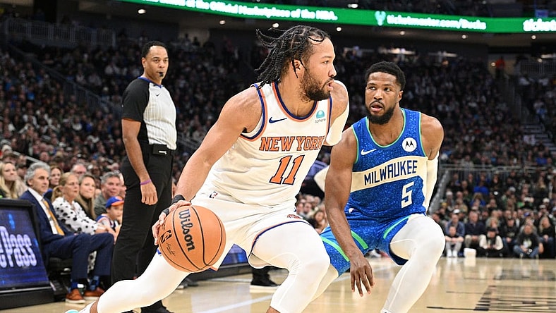Dec 5, 2023; Milwaukee, Wisconsin, USA; New York Knicks guard Jalen Brunson (11) drives to the basket against Milwaukee Bucks guard Malik Beasley (5) in the first half at Fiserv Forum. Mandatory Credit: Michael McLoone-USA TODAY Sports