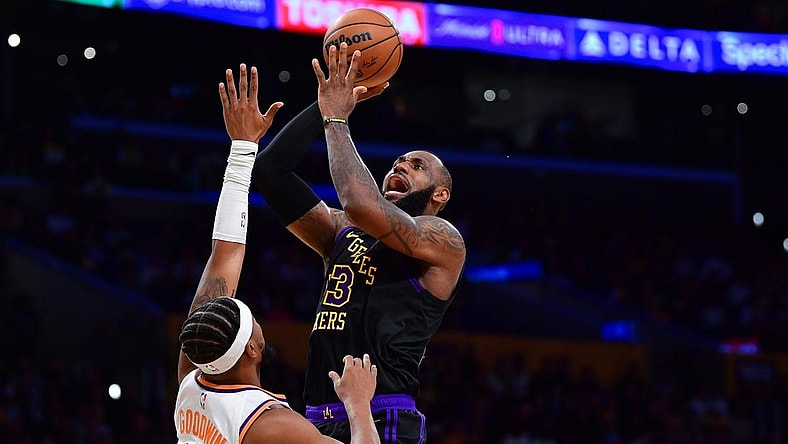Dec 5, 2023; Los Angeles, California, USA; Los Angeles Lakers forward LeBron James (23) shoots against Phoenix Suns guard Jordan Goodwin (0) during the first half of the In Season Tournament quarterfinal at Crypto.com Arena. Mandatory Credit: Gary A. Vasquez-USA TODAY Sports