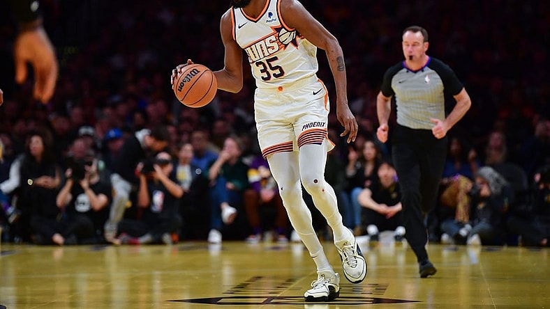 Dec 5, 2023; Los Angeles, California, USA; Phoenix Suns forward Kevin Durant (35) moves the ball up court against the Los Angeles Lakers during the second half of the In Season Tournament quarterfinal at Crypto.com Arena. Mandatory Credit: Gary A. Vasquez-USA TODAY Sports