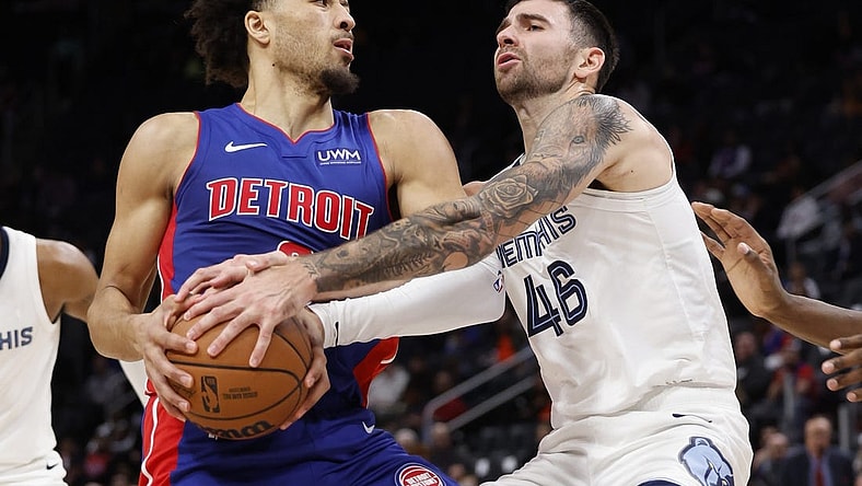 Dec 6, 2023; Detroit, Michigan, USA;  Memphis Grizzlies guard John Konchar (46) strips the ball from Detroit Pistons guard Cade Cunningham (2) in the first half at Little Caesars Arena. Mandatory Credit: Rick Osentoski-USA TODAY Sports