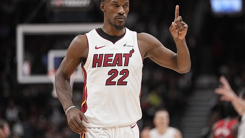 Dec 6, 2023; Toronto, Ontario, CAN; Miami Heat forward Jimmy Butler (22) gestures his bench during the fourth quarter against the Toronto Raptors at Scotiabank Arena. Mandatory Credit: John E. Sokolowski-USA TODAY Sports