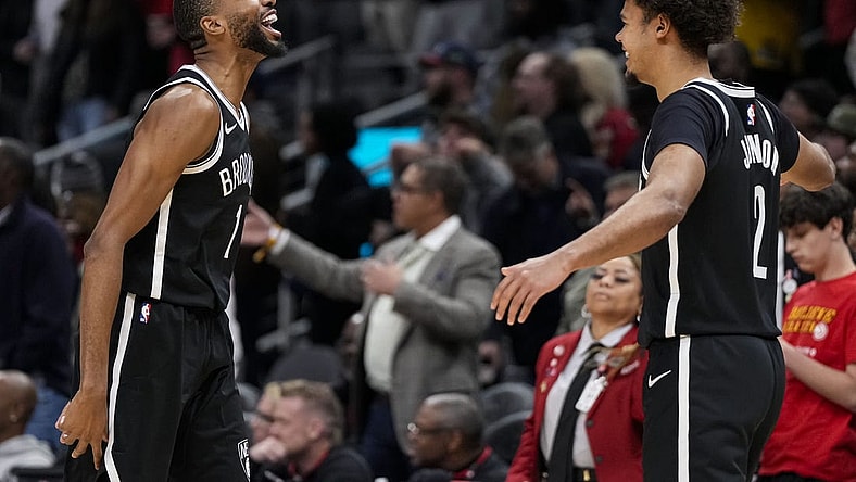 Dec 6, 2023; Atlanta, Georgia, USA; Brooklyn Nets forward Mikal Bridges (1) reacts with forward Cameron Johnson (2) after the Nets defeated the Atlanta Hawks at State Farm Arena. Mandatory Credit: Dale Zanine-USA TODAY Sports