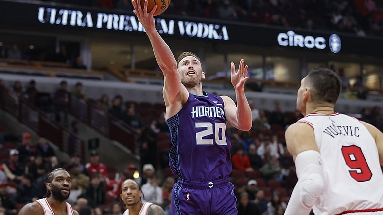 Dec 6, 2023; Chicago, Illinois, USA; Charlotte Hornets forward Gordon Hayward (20) goes to the basket against Chicago Bulls center Nikola Vucevic (9) during the first half at United Center. Mandatory Credit: Kamil Krzaczynski-USA TODAY Sports