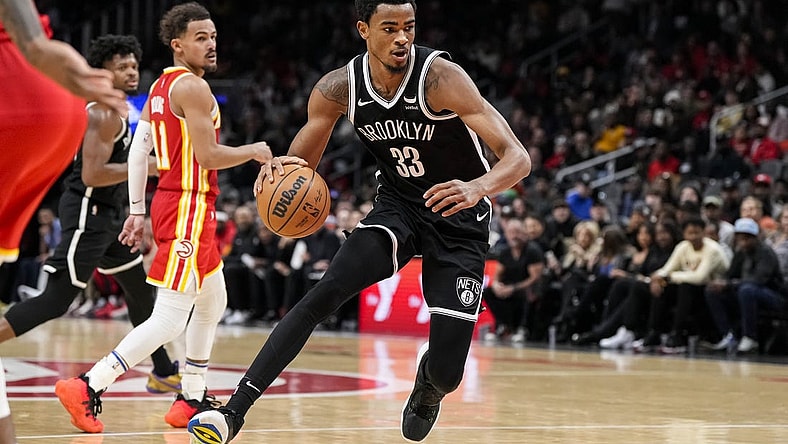 Dec 6, 2023; Atlanta, Georgia, USA; Brooklyn Nets center Nic Claxton (33) controls the ball against the Atlanta Hawks during the second half at State Farm Arena. Mandatory Credit: Dale Zanine-USA TODAY Sports