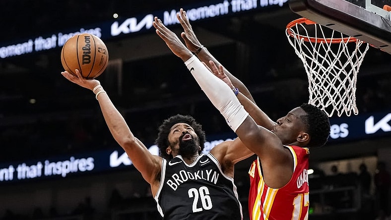 Dec 6, 2023; Atlanta, Georgia, USA; Brooklyn Nets guard Spencer Dinwiddie (26) shoots defended by Atlanta Hawks forward Onyeka Okongwu (17) during the second half at State Farm Arena. Mandatory Credit: Dale Zanine-USA TODAY Sports