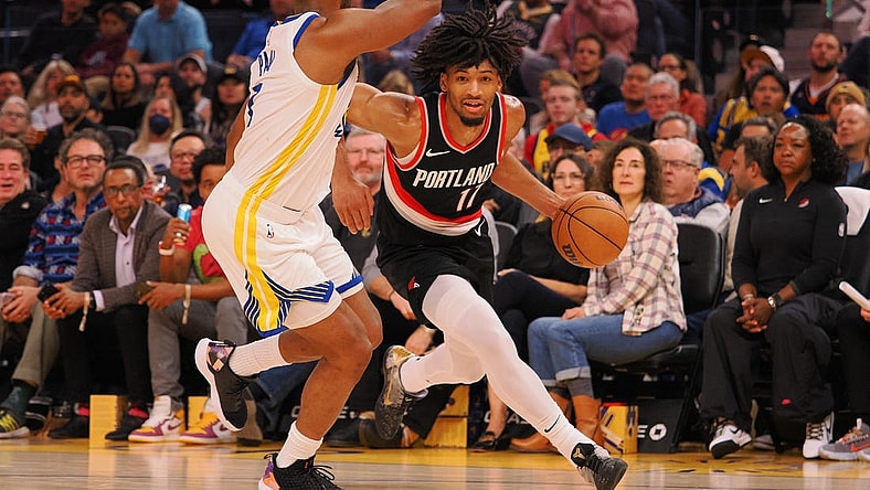 Dec 6, 2023; San Francisco, California, USA; Portland Trail Blazers guard Shaedon Sharpe (17) drives in against Golden State Warriors guard Chris Paul (3) during the second quarter at Chase Center. Mandatory Credit: Kelley L Cox-USA TODAY Sports