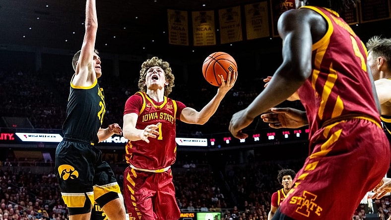 Iowa State's Jackson Paveletzke attempts a shot against Iowa's Payton Sandfort during a basketball game at Hilton Coliseum on Thursday, Dec. 7, 2023, in Ames.