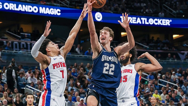 Dec 8, 2023; Orlando, Florida, USA; Orlando Magic forward Franz Wagner (22) goes to the basket against Detroit Pistons guard Killian Hayes (7) during the second quarter at Amway Center. Mandatory Credit: Mike Watters-USA TODAY Sports