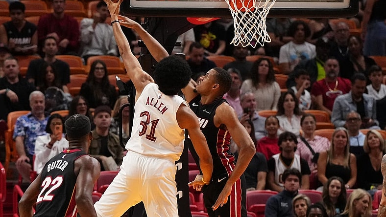 Dec 8, 2023; Miami, Florida, USA; Cleveland Cavaliers center Jarrett Allen (31) puts up a shot over Miami Heat center Orlando Robinson (25) during the first half at Kaseya Center. Mandatory Credit: Jasen Vinlove-USA TODAY Sports