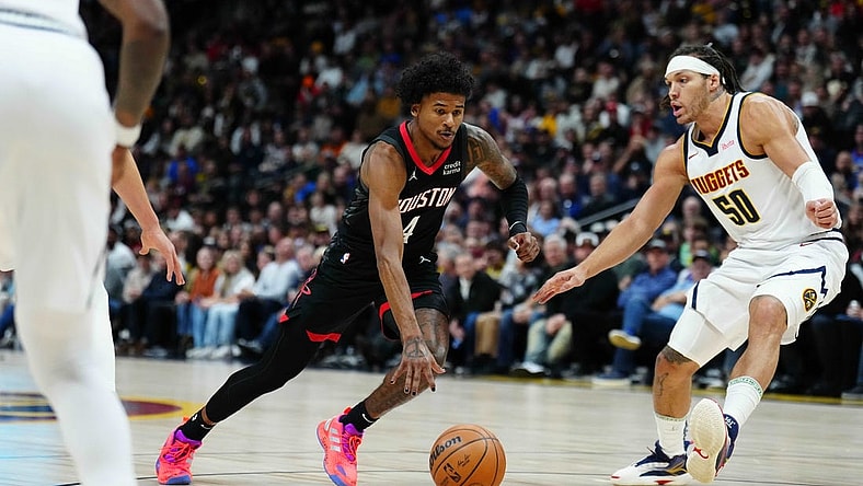 Dec 8, 2023; Denver, Colorado, USA; Houston Rockets guard Jalen Green (4) drives at Denver Nuggets forward Aaron Gordon (50) in the first quarter at Ball Arena. Mandatory Credit: Ron Chenoy-USA TODAY Sports