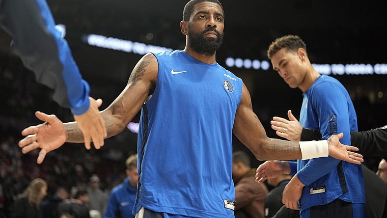 Dec 8, 2023; Portland, Oregon, USA; Dallas Mavericks point guard Kyrie Irving (11) is introduced as part of the starting lineup before the game against the Portland Trail Blazers at Moda Center. Mandatory Credit: Soobum Im-USA TODAY Sports