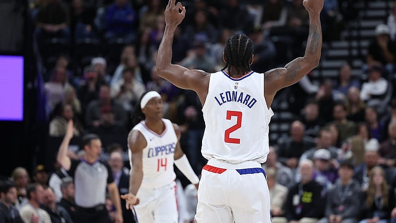 Dec 8, 2023; Salt Lake City, Utah, USA; Los Angeles Clippers forward Kawhi Leonard (2) reads to a three point shot against the Utah Jazz during the second quarter at Delta Center. Mandatory Credit: Rob Gray-USA TODAY Sports