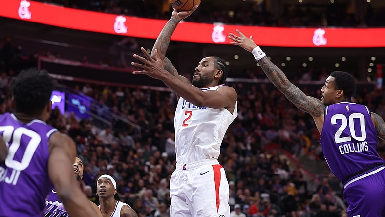 Dec 8, 2023; Salt Lake City, Utah, USA; Los Angeles Clippers forward Kawhi Leonard (2) shoots the ball past Utah Jazz forward John Collins (20) during the third quarter at Delta Center. Mandatory Credit: Rob Gray-USA TODAY Sports