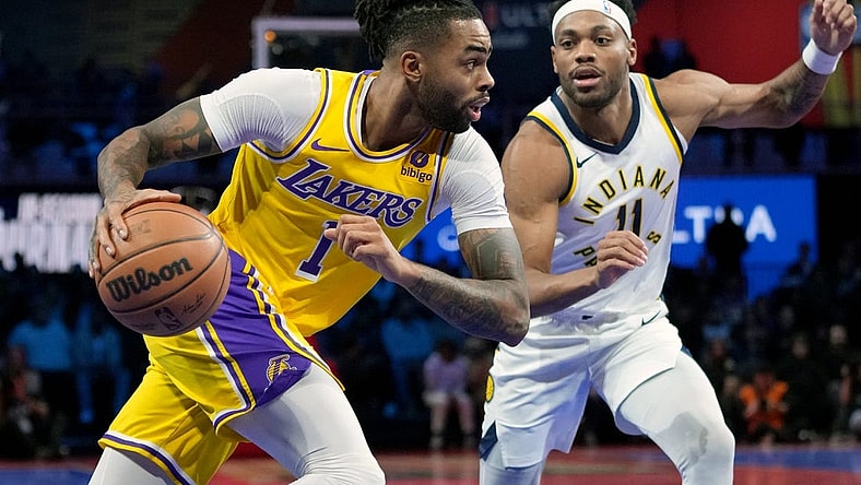 Dec 9, 2023; Las Vegas, Nevada, USA; Los Angeles Lakers guard D'Angelo Russell (1) drives against Indiana Pacers forward Bruce Brown (11) in the third quarter of the in season tournament championship final at T-Mobile Arena. Mandatory Credit: Kyle Terada-USA TODAY Sports
