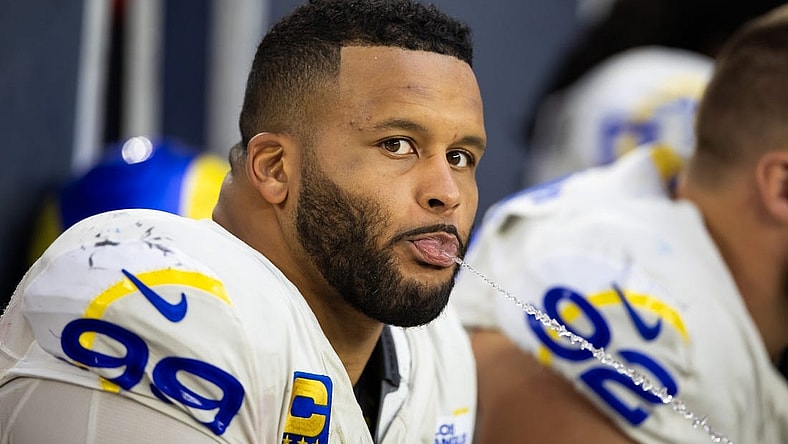Nov 26, 2023; Glendale, Arizona, USA; Los Angeles Rams defensive tackle Aaron Donald (99) spits water out of his mouth against the Arizona Cardinals at State Farm Stadium. Mandatory Credit: Mark J. Rebilas-USA TODAY Sports