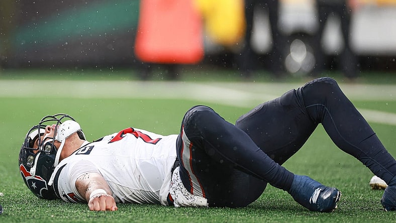 Dec 10, 2023; East Rutherford, New Jersey, USA; Houston Texans quarterback C.J. Stroud (7) on the field after an apparent injury during the second half against the New York Jets at MetLife Stadium. Mandatory Credit: Vincent Carchietta-USA TODAY Sports