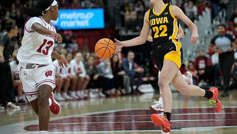 Dec 10, 2023; Madison, Wis. USA; Iowa guard Caitlin Clark (22) is on a fast break against Wisconsin during the second half  at the Kohl Center. Mandatory Credit   Mark Hoffman/USA TODAY Sports Network via Milwaukee Journal Sentinel