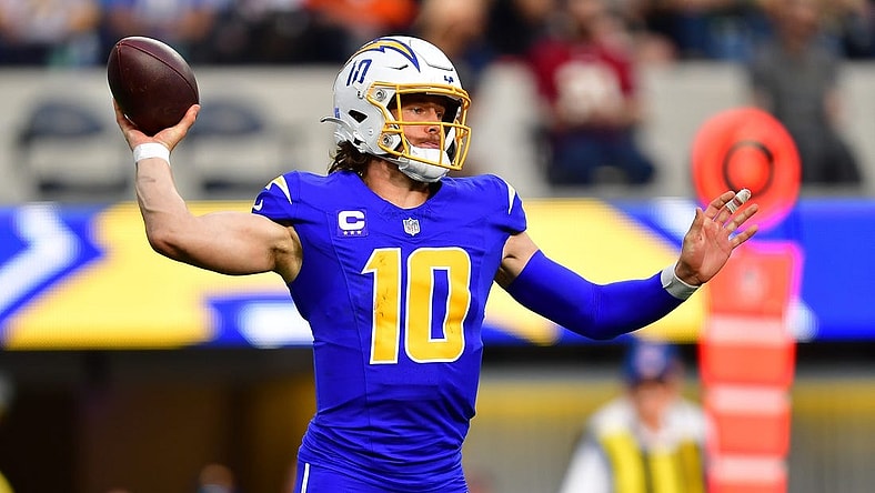 Dec 10, 2023; Inglewood, California, USA; Los Angeles Chargers quarterback Justin Herbert (10) throws against the Denver Broncos during the first half at SoFi Stadium. Mandatory Credit: Gary A. Vasquez-USA TODAY Sports