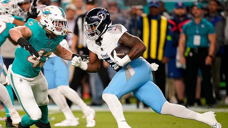 Tennessee Titans wide receiver Treylon Burks (16) is stopped by Miami Dolphins linebacker Andrew Van Ginkel (43) during the first quarter at Hard Rock Stadium in Miami, Fla., Monday, Dec. 11, 2023.