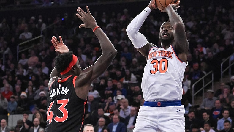 Dec 11, 2023; New York, New York, USA; New York Knicks forward Julius Randle (30) shoots the ball while being defended by Toronto Raptors forward Pascal Siakam (43) during the first quarter at Madison Square Garden. Mandatory Credit: John Jones-USA TODAY Sports