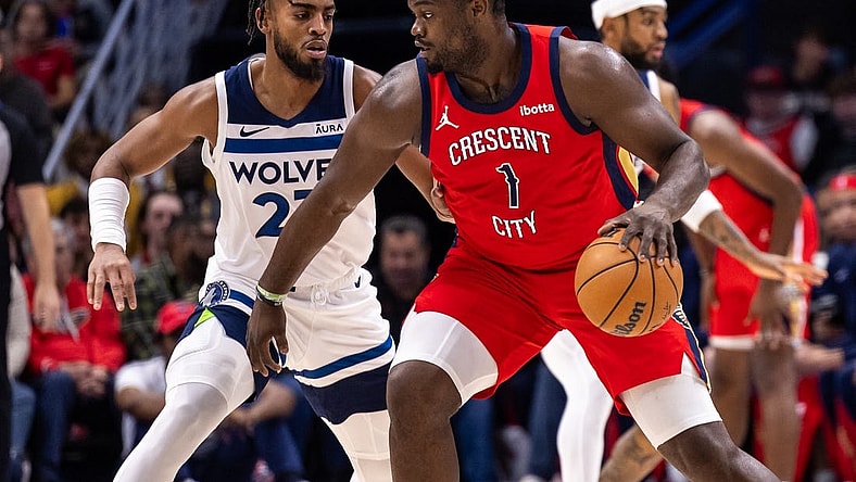 Dec 11, 2023; New Orleans, Louisiana, USA; New Orleans Pelicans forward Zion Williamson (1) dribbles against Minnesota Timberwolves forward Troy Brown Jr. (23) during the first half at the Smoothie King Center. Mandatory Credit: Stephen Lew-USA TODAY Sports