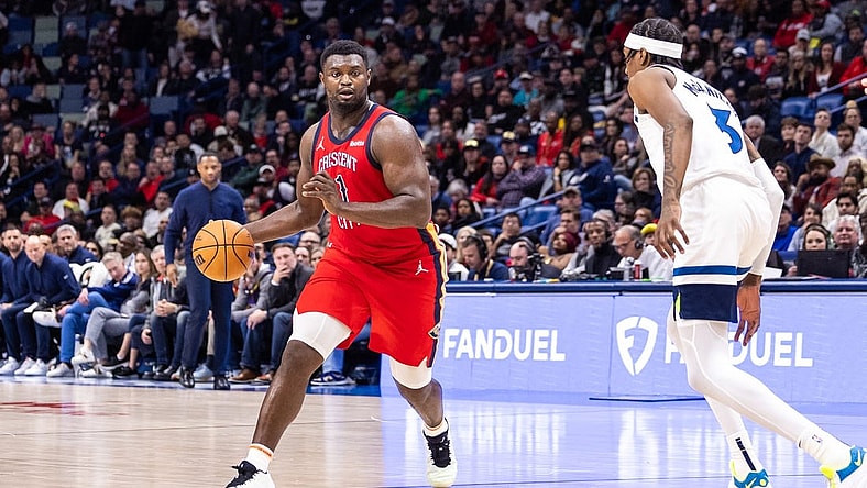 Dec 11, 2023; New Orleans, Louisiana, USA; New Orleans Pelicans forward Zion Williamson (1) dribbles against Minnesota Timberwolves forward Jaden McDaniels (3) during the second half at the Smoothie King Center. Mandatory Credit: Stephen Lew-USA TODAY Sports