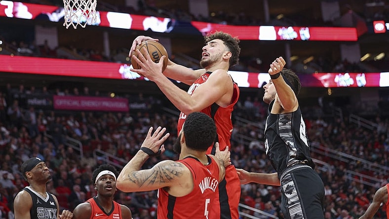 Dec 11, 2023; Houston, Texas, USA; Houston Rockets center Alperen Sengun (28) grabs a rebound during the third quarter against the San Antonio Spurs at Toyota Center. Mandatory Credit: Troy Taormina-USA TODAY Sports