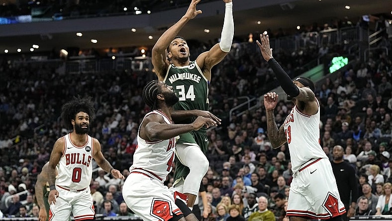 Dec 11, 2023; Milwaukee, Wisconsin, USA;  Milwaukee Bucks forward Giannis Antetokounmpo (34) shoots over Chicago Bulls forward Patrick Williams (44) during the fourth quarter at Fiserv Forum. Mandatory Credit: Jeff Hanisch-USA TODAY Sports
