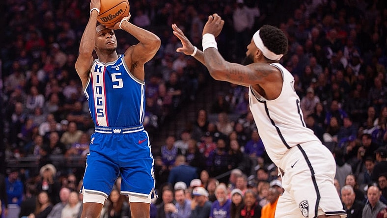 Dec 11, 2023; Sacramento, California, USA; Sacramento Kings guard De'Aaron Fox (5) takes a jump shot during the first quarter at Golden 1 Center. Mandatory Credit: Ed Szczepanski-USA TODAY Sports