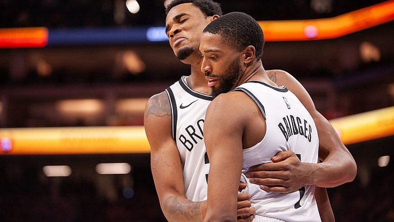 Dec 11, 2023; Sacramento, California, USA; Brooklyn Nets center Nic Claxton (33) and forward Mikal Bridges (1) embrace after a called foul during the fourth quarter against the Sacramento Kings at Golden 1 Center. Mandatory Credit: Ed Szczepanski-USA TODAY Sports