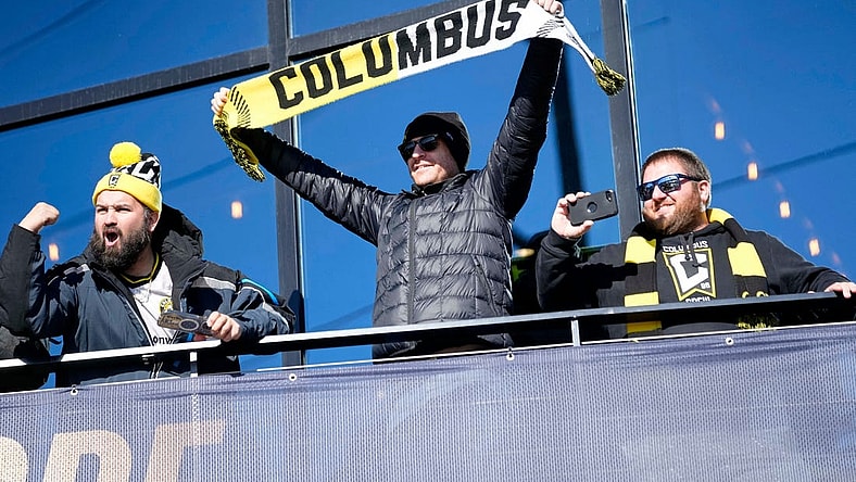 Dec 12, 2023; Columbus, OH, USA; Columbus Crew fans cheer as they watch a parade celebrating their 2023 MLS Cup victory at Lower.com Field.