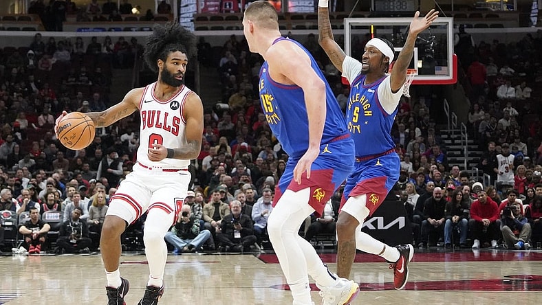 Dec 12, 2023; Chicago, Illinois, USA; Denver Nuggets forward Aaron Gordon (50) defends Chicago Bulls guard Coby White (0) during the first half at United Center. Mandatory Credit: David Banks-USA TODAY Sports