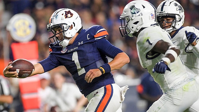 Auburn Tigers quarterback Payton Thorne (1) stretches the ball out as he crosses the goalline for a touchdown against Samford Bulldogs defensive back Kourtlan Marsh (1) during second half action in the AU vs. Samford game at Jordan-Hare Stadium in the AU campus in Auburn, Ala., on Saturday September 16, 2023.