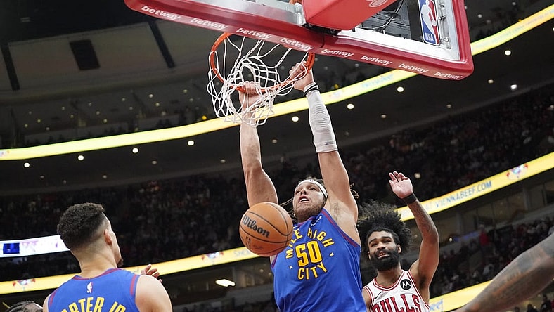 Dec 12, 2023; Chicago, Illinois, USA; Denver Nuggets forward Aaron Gordon (50) dunks the ball against the Chicago Bulls during the second half at United Center. Mandatory Credit: David Banks-USA TODAY Sports