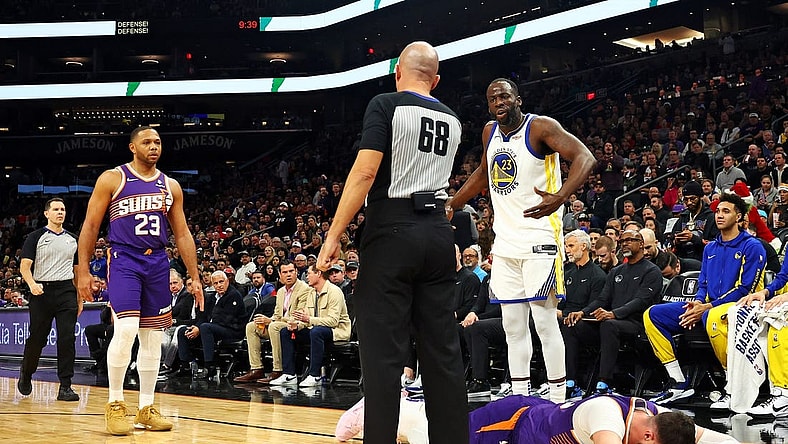 Dec 12, 2023; Phoenix, Arizona, USA; Golden State Warriors forward Draymond Green (23) reacts after being called for a foul on Phoenix Suns center Jusuf Nurkic (20) during the third quarter at Footprint Center. Mandatory Credit: Mark J. Rebilas-USA TODAY Sports