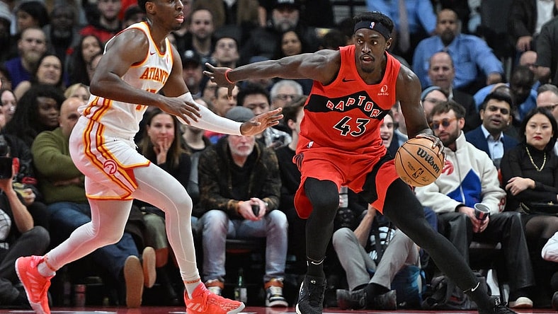 Dec 13, 2023; Toronto, Ontario, CAN;   Toronto Raptors forward Pascal Siakam (43) dribbles the ball as Atlanta Hawks forward Onyeka Okongwu (17) defends in the first half at Scotiabank Arena. Mandatory Credit: Dan Hamilton-USA TODAY Sports
